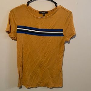 The shirt is a gold yellow, soft and stretchy material